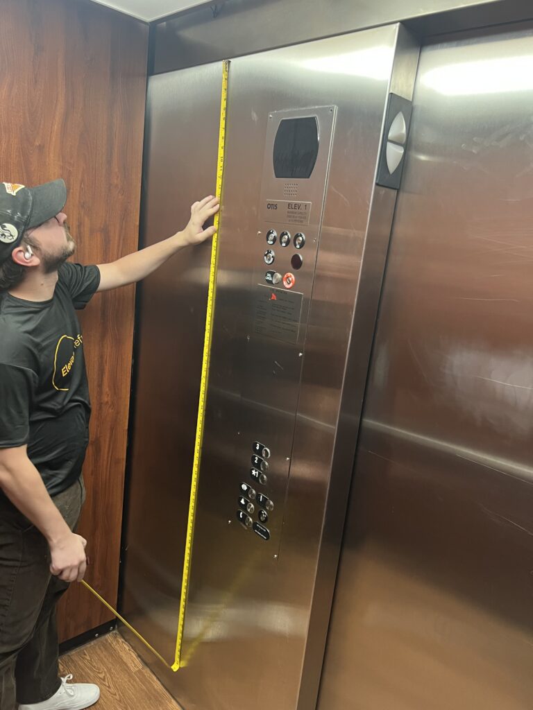 Elevator Refresh Installer Measuring Panels to Wrap in Architectural Film